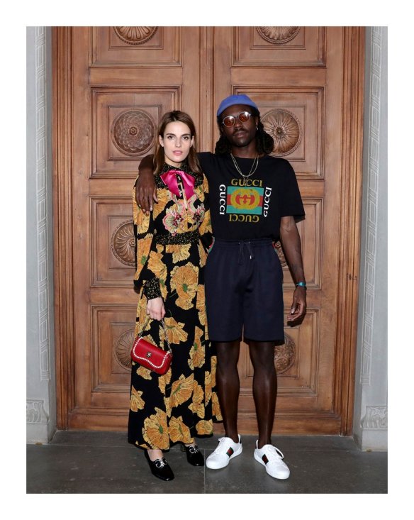 Dev Hynes poses alongside friend at the Gucci resort 2018 fashion show